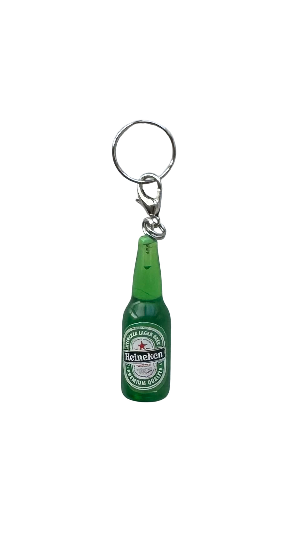Green Heineken bottle charm on a white background