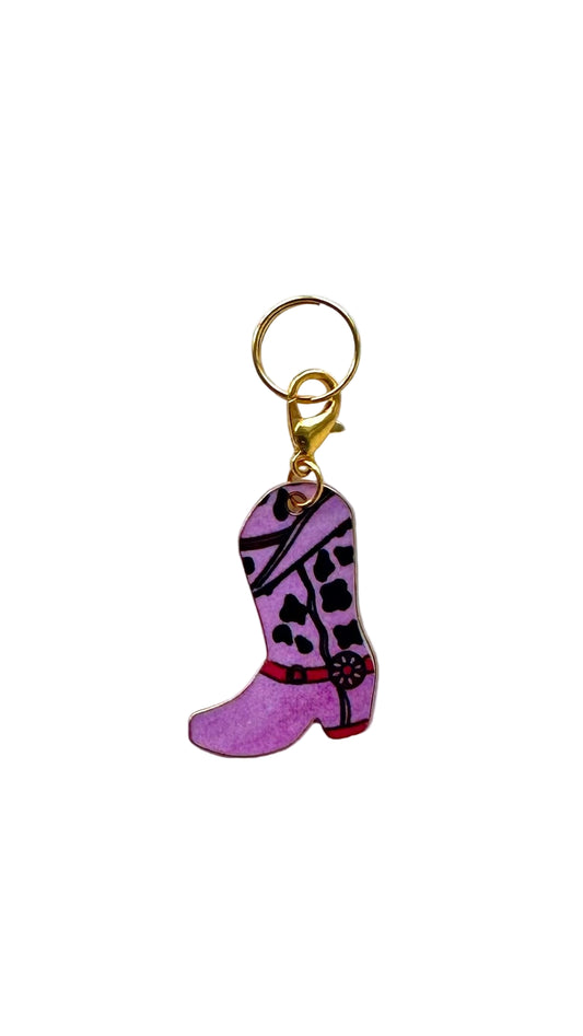 Purple cowboy boot charm with gold clasp on a white background
