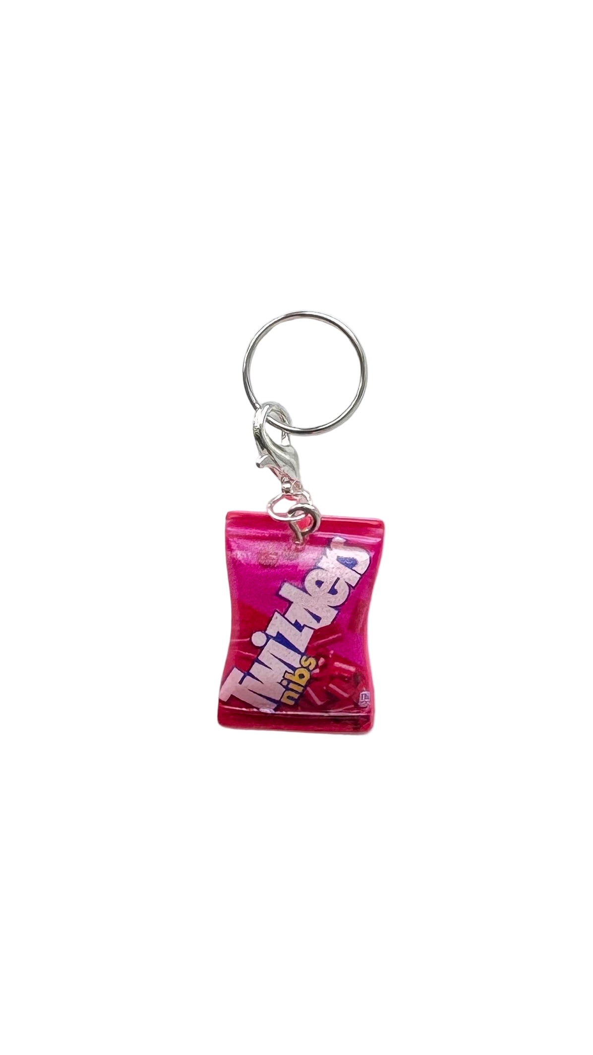 Pink Twizzler charm on a white background