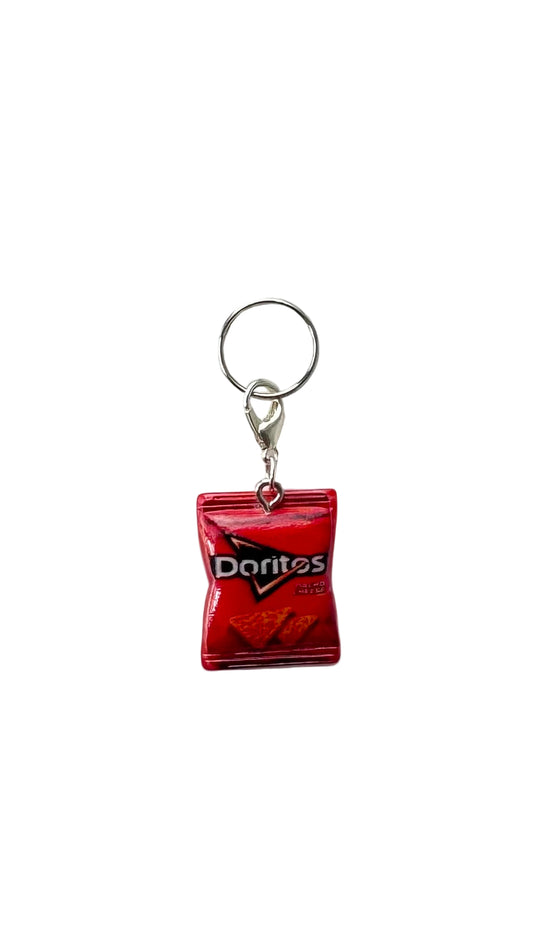 Red Doritos bag charm on a white background