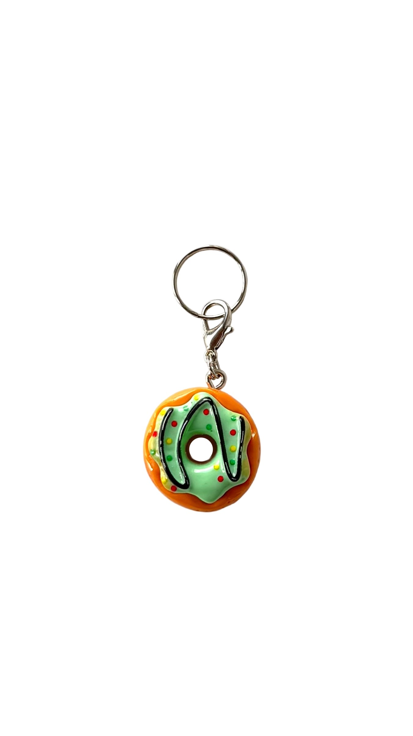 Donut-shaped charm with a white background