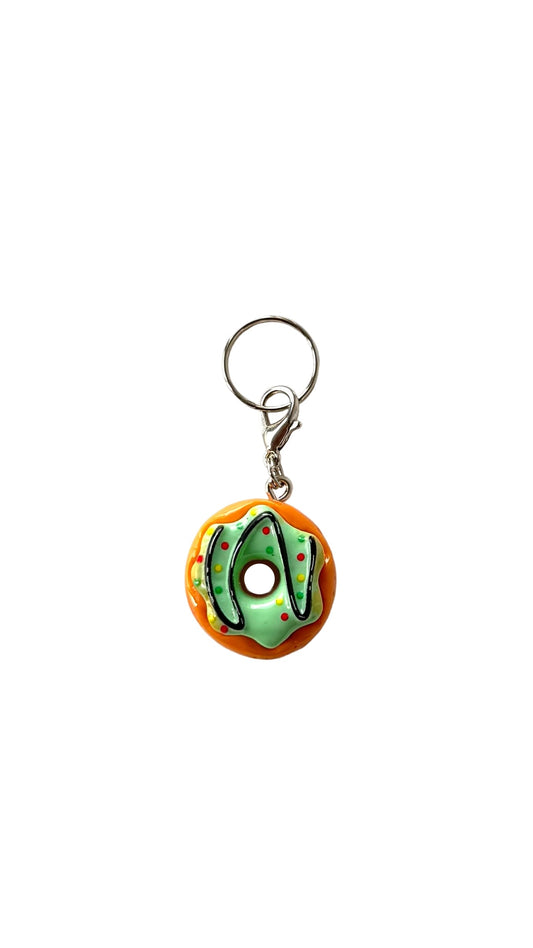 Donut-shaped charm with a white background