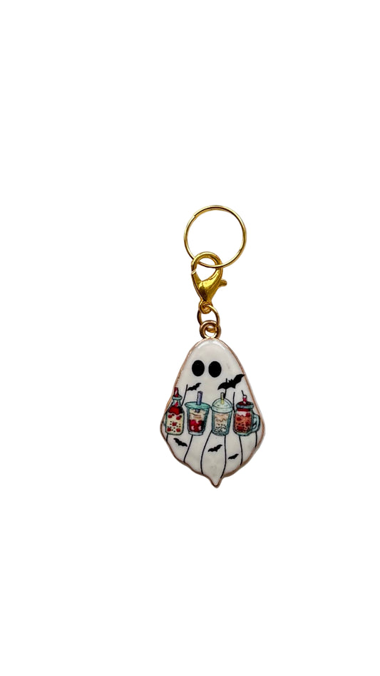 Ghost keychain with colorful details on a white background