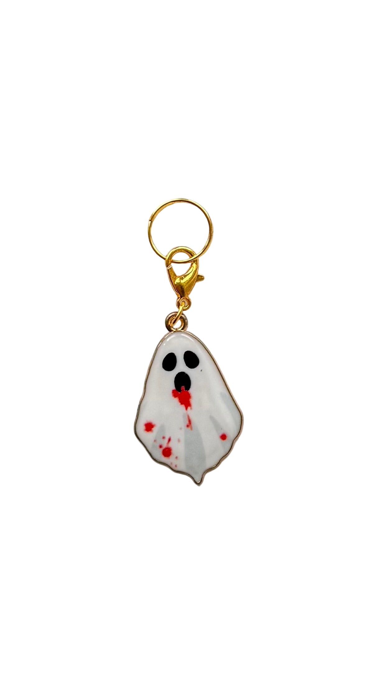Ghost charm with bloodstains on a white background