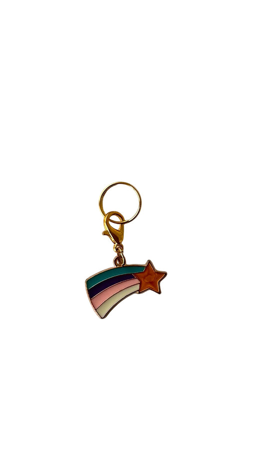 Keychain with rainbow and star design on a white background